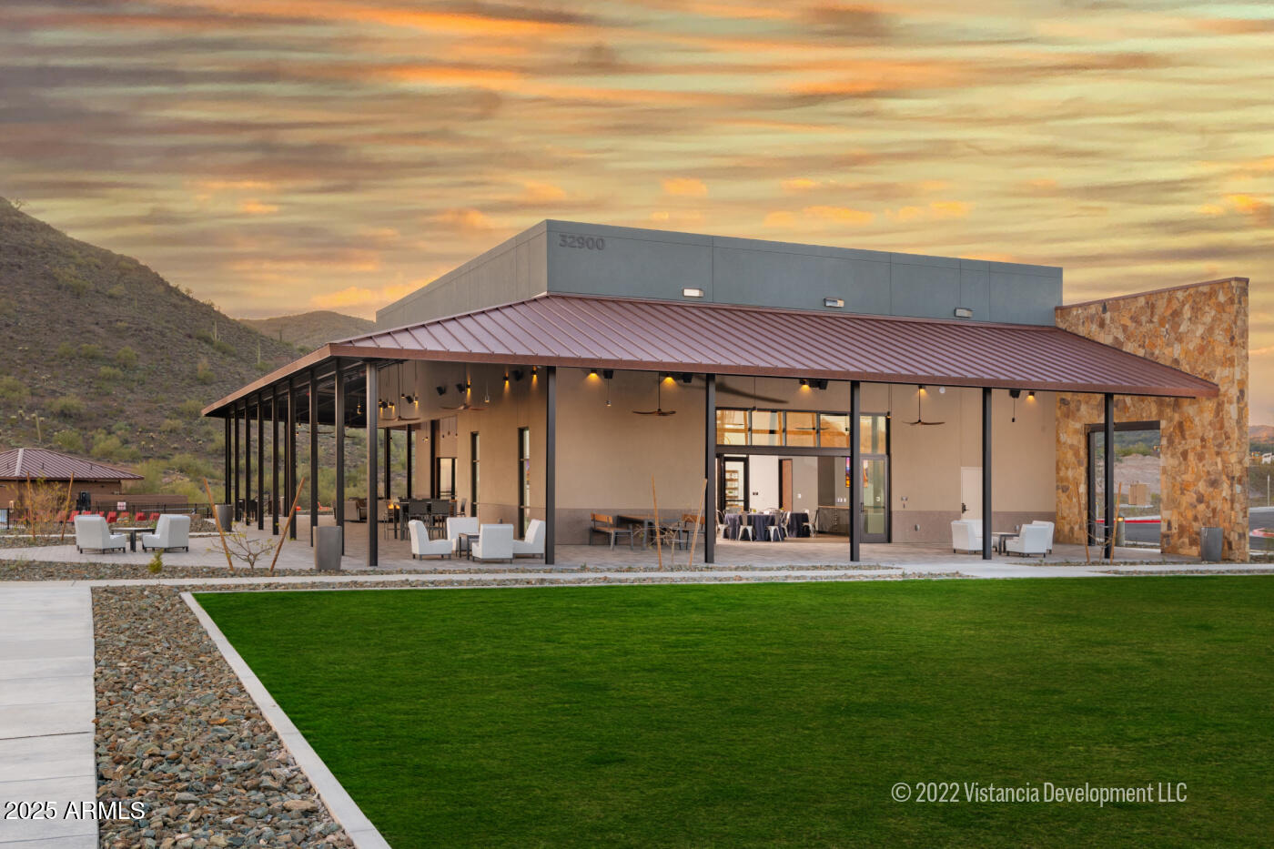 13423 West Eagle Feather Road Peoria, AZ 85383 - Photo 19 of 30 a front view of a house with a yard table and chairs