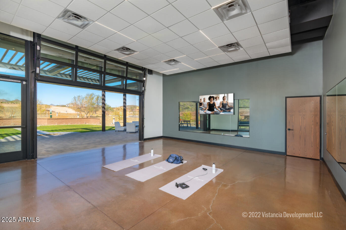 13423 West Eagle Feather Road Peoria, AZ 85383 - Photo 27 of 30 a living room with furniture and a flat screen tv