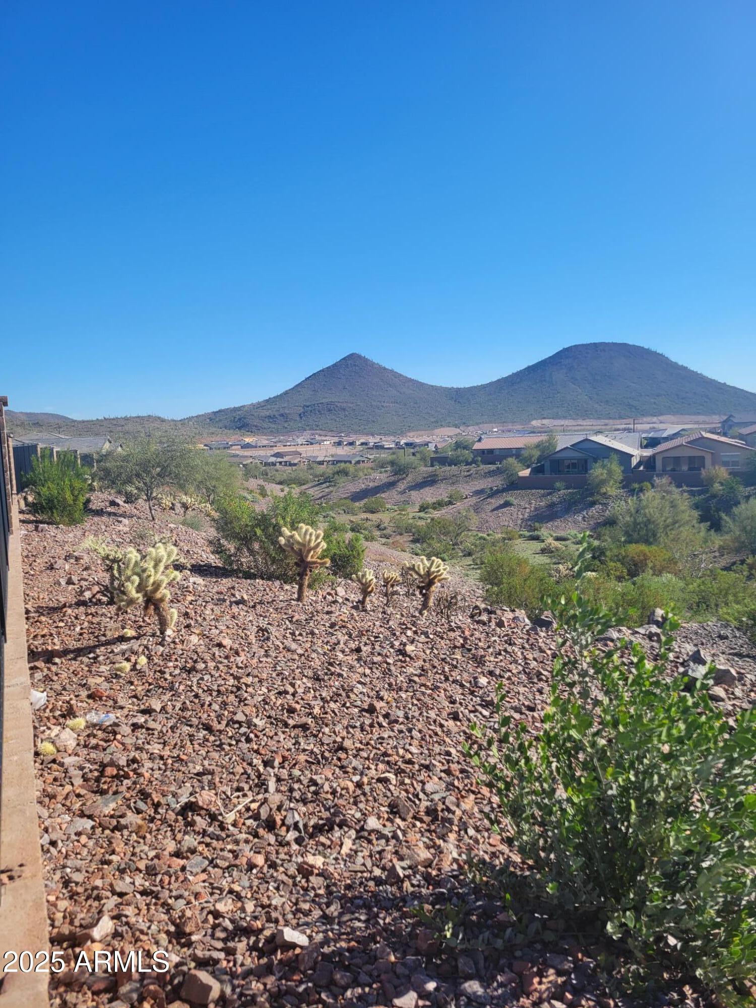 13423 West Eagle Feather Road Peoria, AZ 85383 - Photo 7 of 30 a view of a mountain with a outdoor space