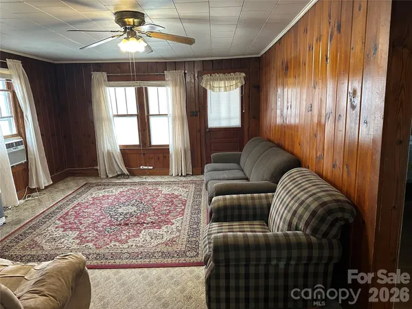 a living room with furniture and window