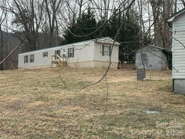 a house view with a backyard space