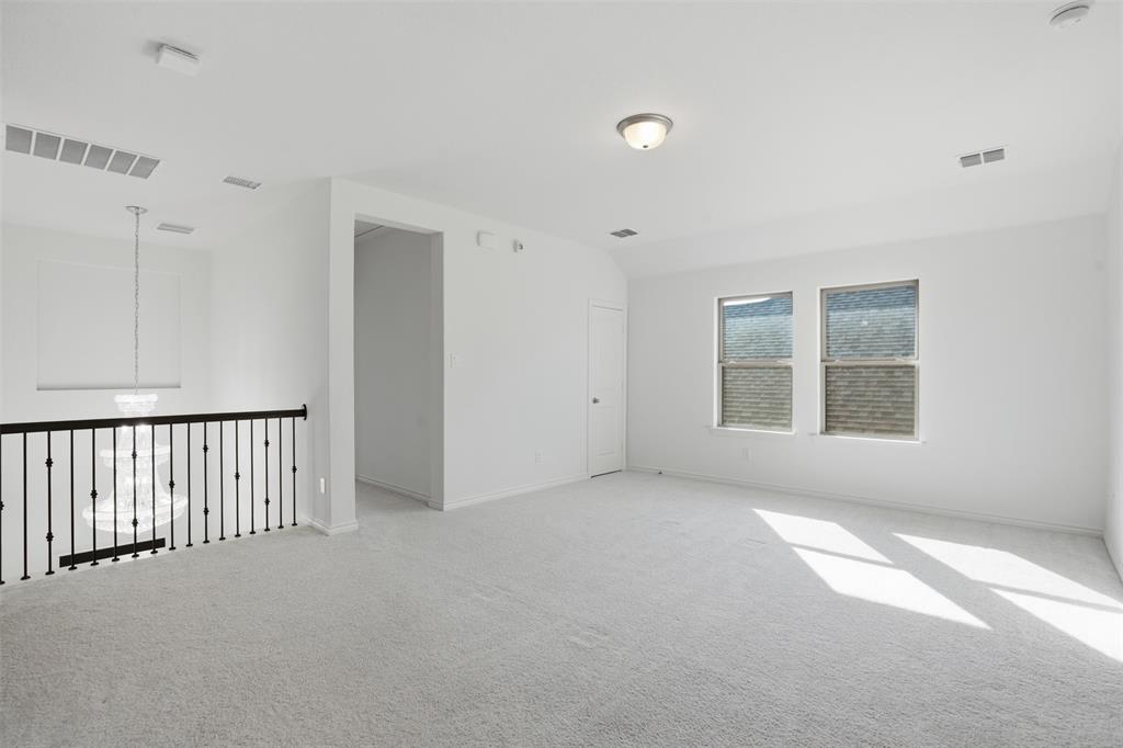 537 Oakmoss Street Little Elm, TX 76227 - Photo 18 of 39 a view of empty room with windows