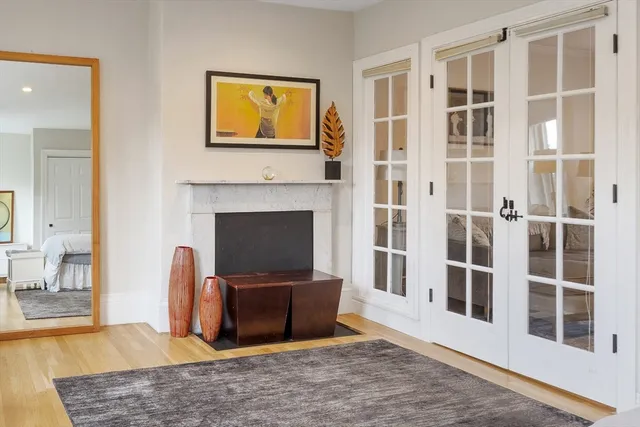 a living room with furniture a fireplace and a table