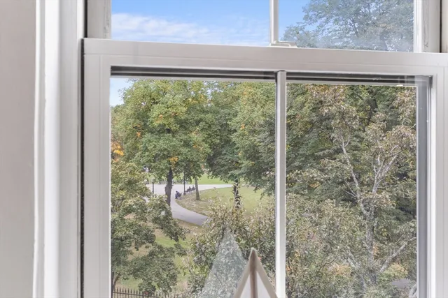 a view of a room that has a large window