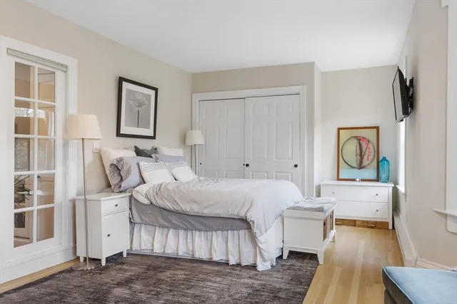 a bedroom with a bed and a couch