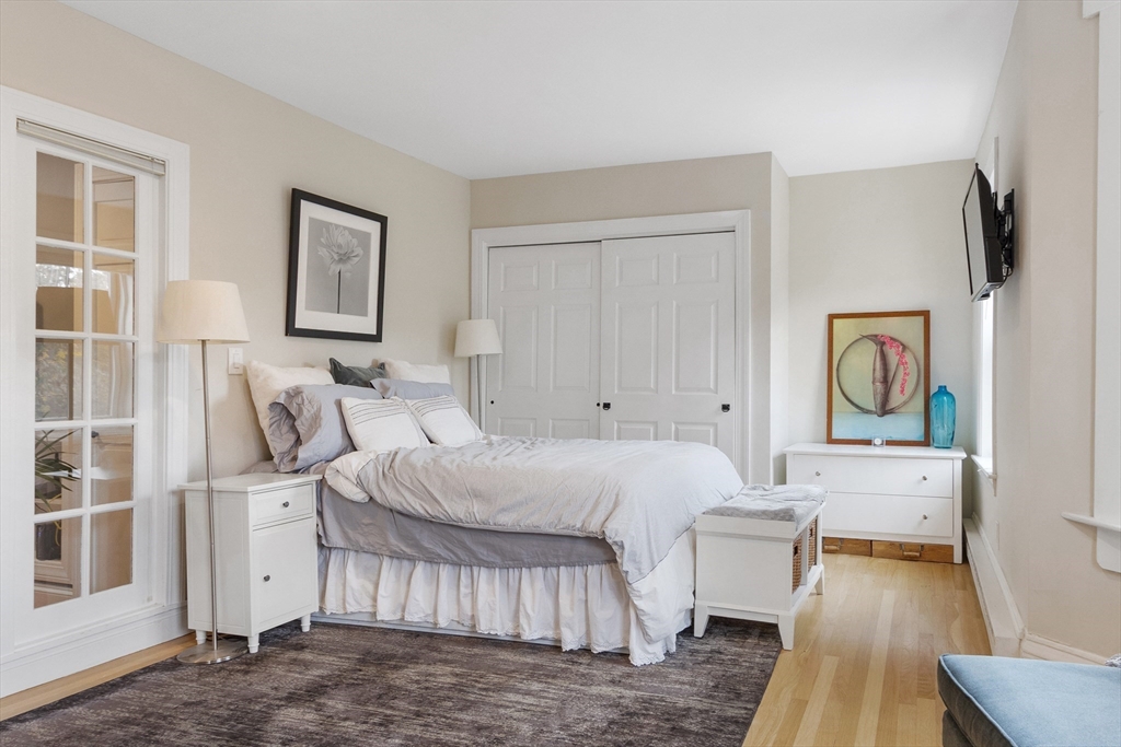 431 Shawmut Avenue, Unit PH Boston, MA 02118 - Photo 8 of 27 a bedroom with a bed and a couch