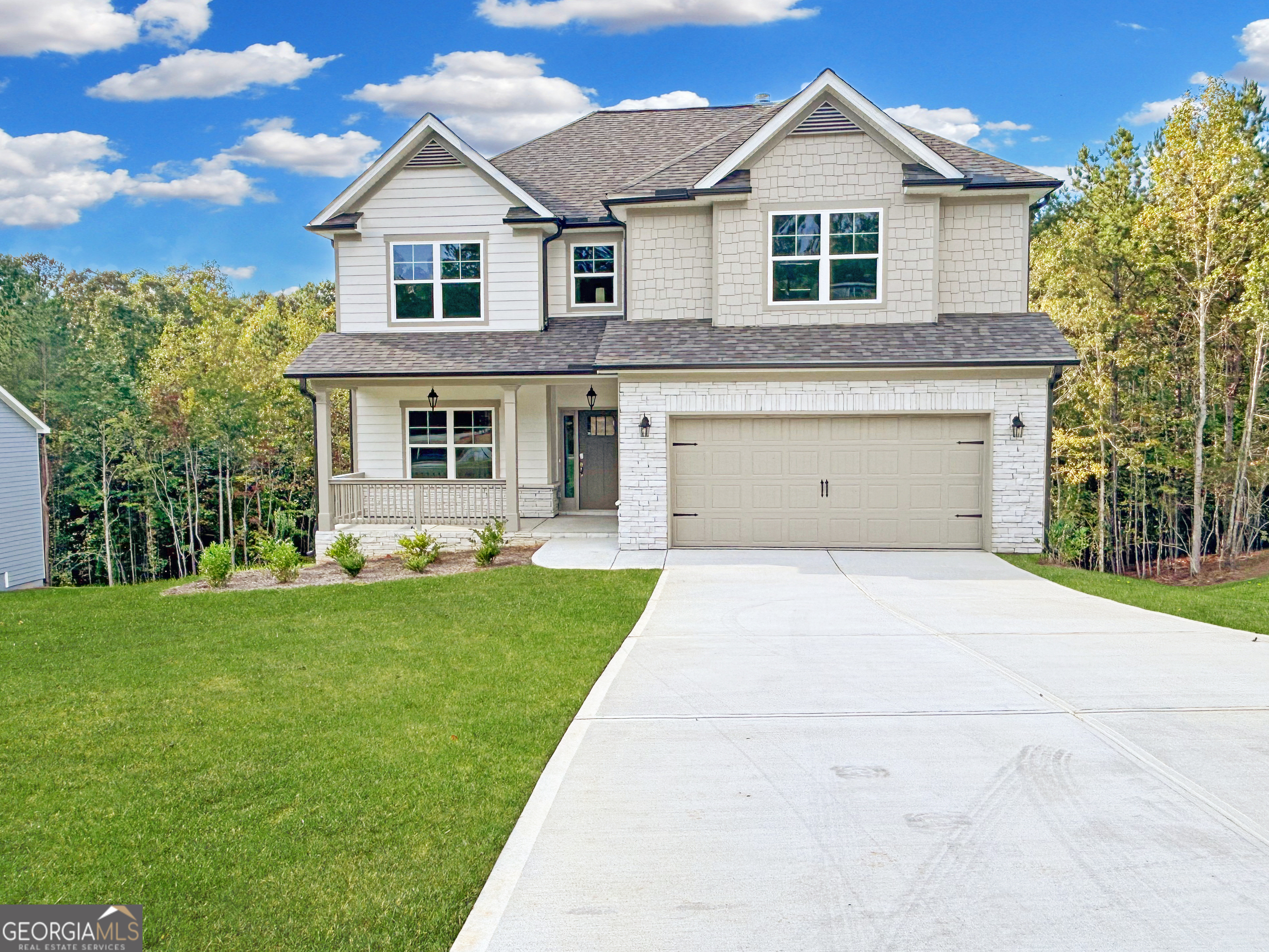 517 Principal Meridian Drive, Unit 22 Dallas, GA 30132 - Photo 1 of 17 a front view of a house with a yard and garage