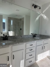 517 Principal Meridian Drive, Unit 22 Dallas, GA 30132 - Photo 12 of 17 a bathroom with a sink and a mirror