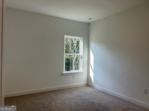 517 Principal Meridian Drive, Unit 22 Dallas, GA 30132 - Photo 6 of 17 an empty room with a window