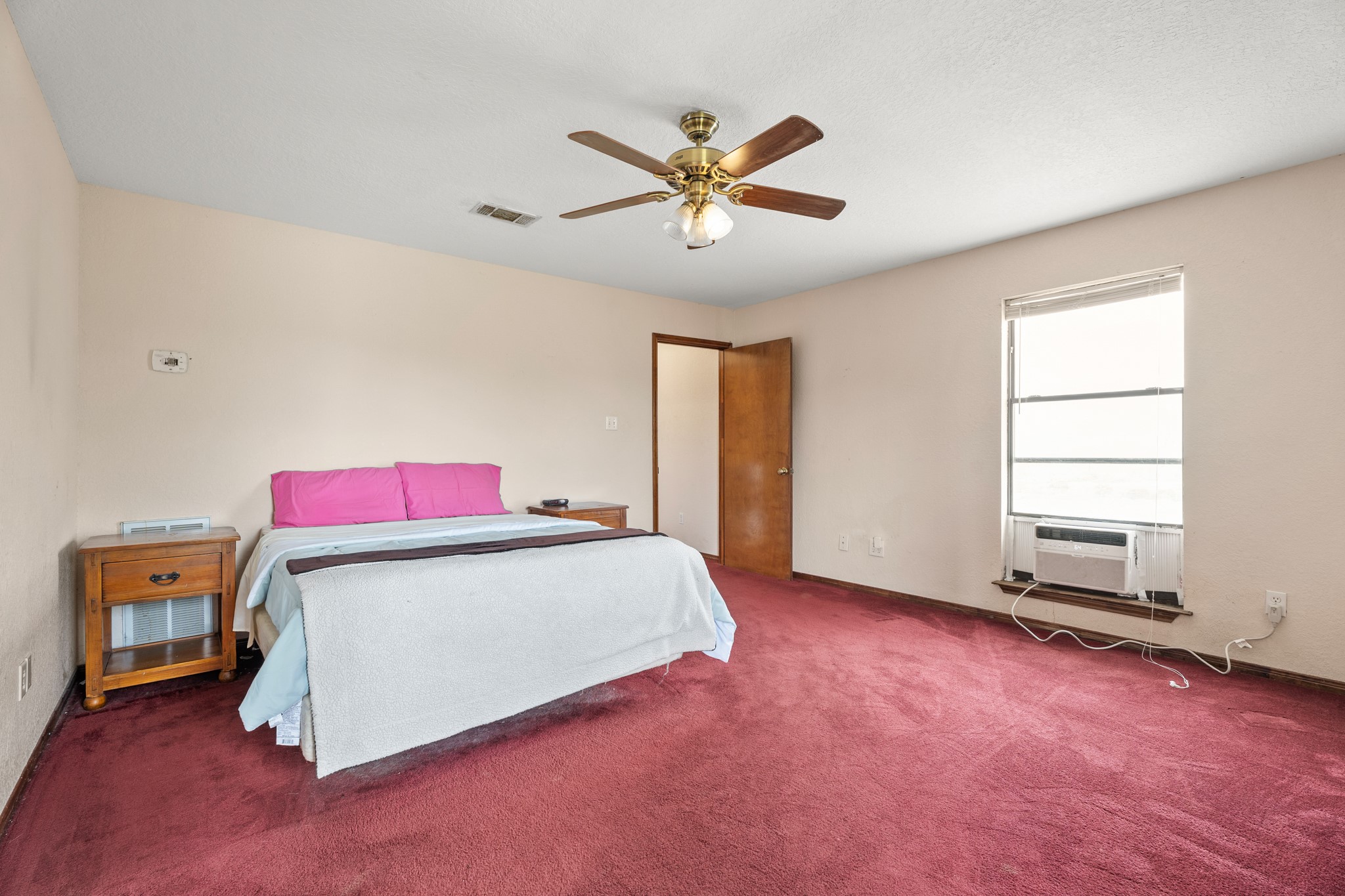 13803 Norris Road Rosharon, TX 77583 - Photo 11 of 20 a bedroom with a bed and window