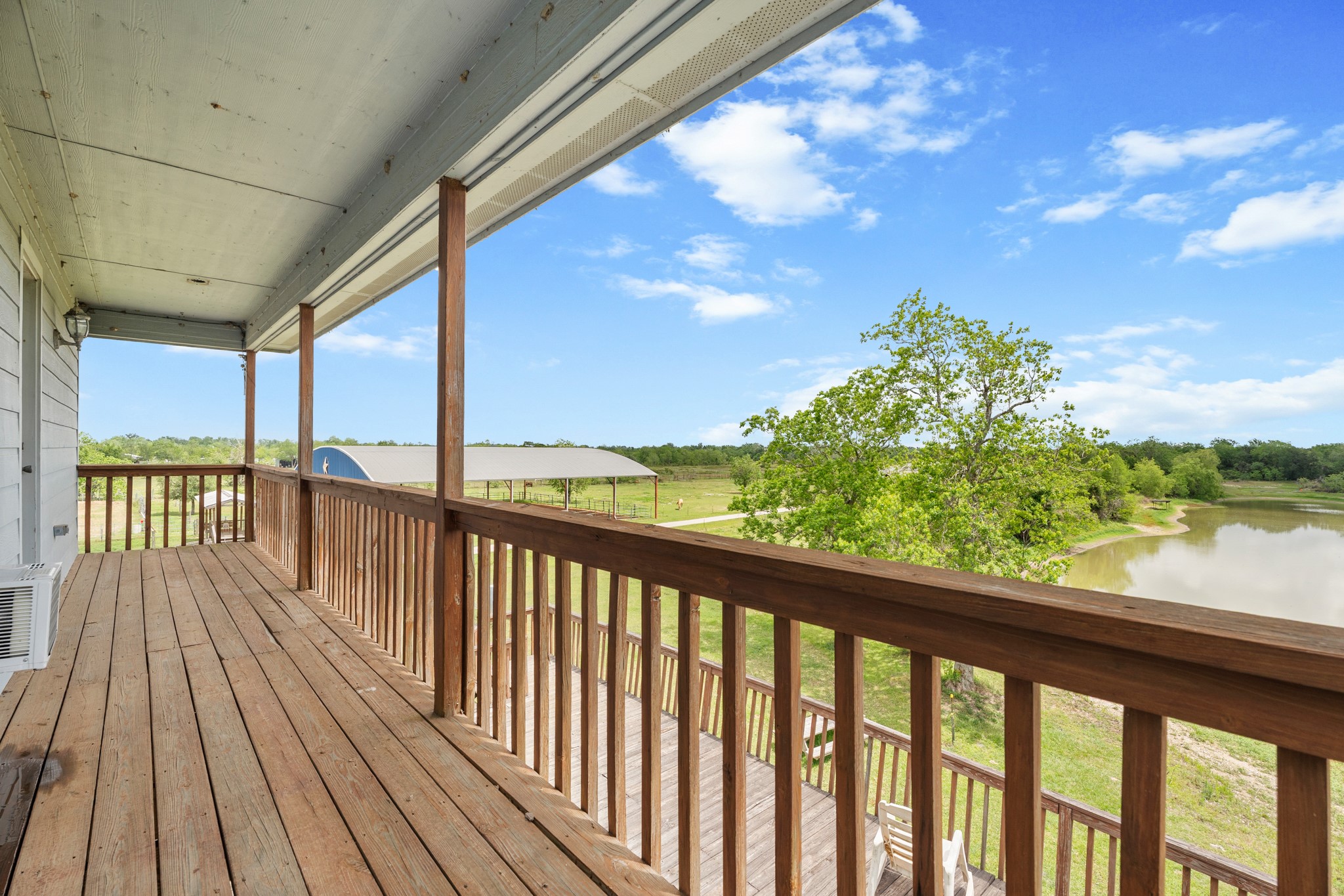 13803 Norris Road Rosharon, TX 77583 - Photo 12 of 20 a view of balcony with wooden floor