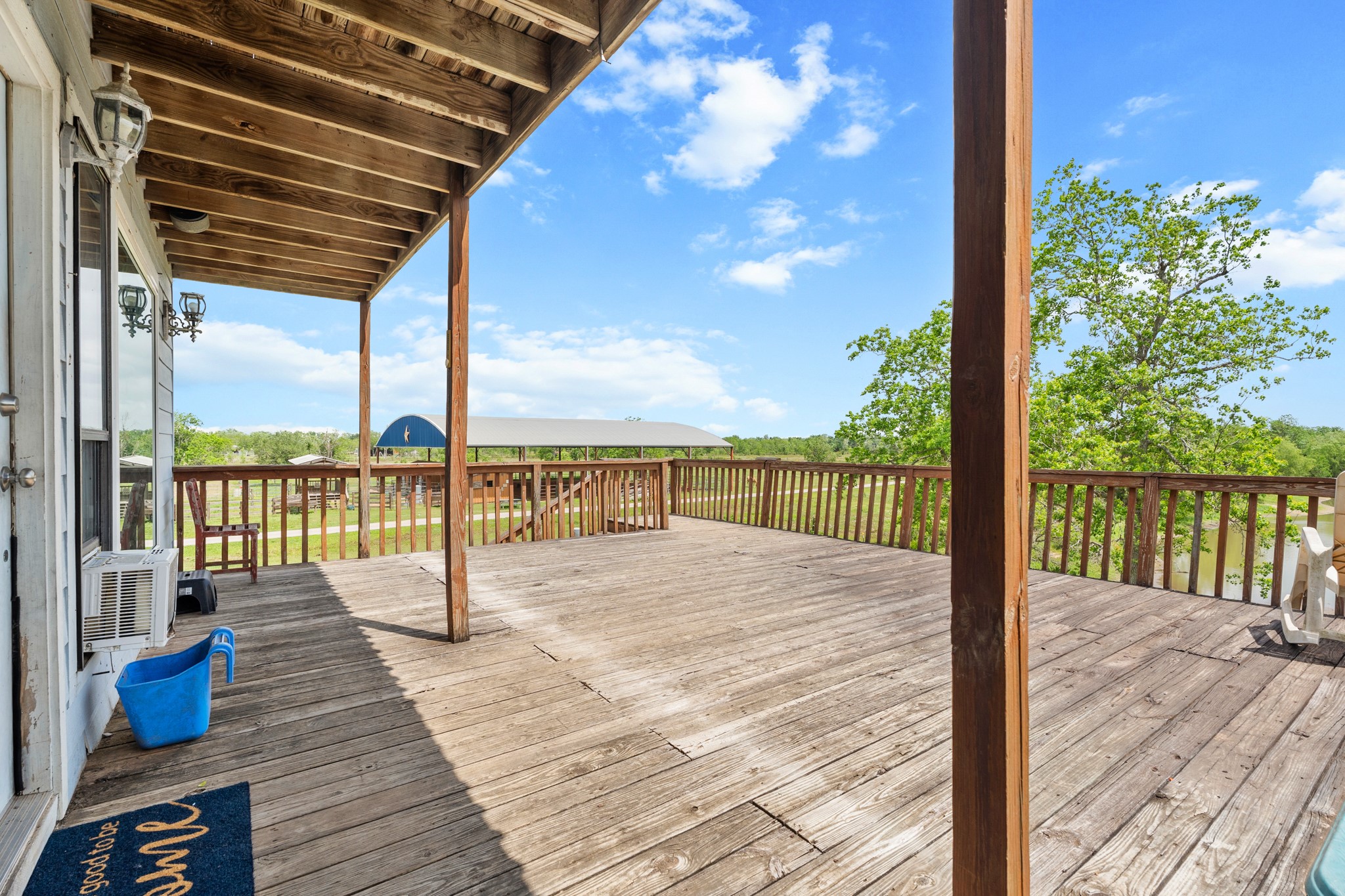 13803 Norris Road Rosharon, TX 77583 - Photo 14 of 20 a view of balcony with wooden floor and seating space
