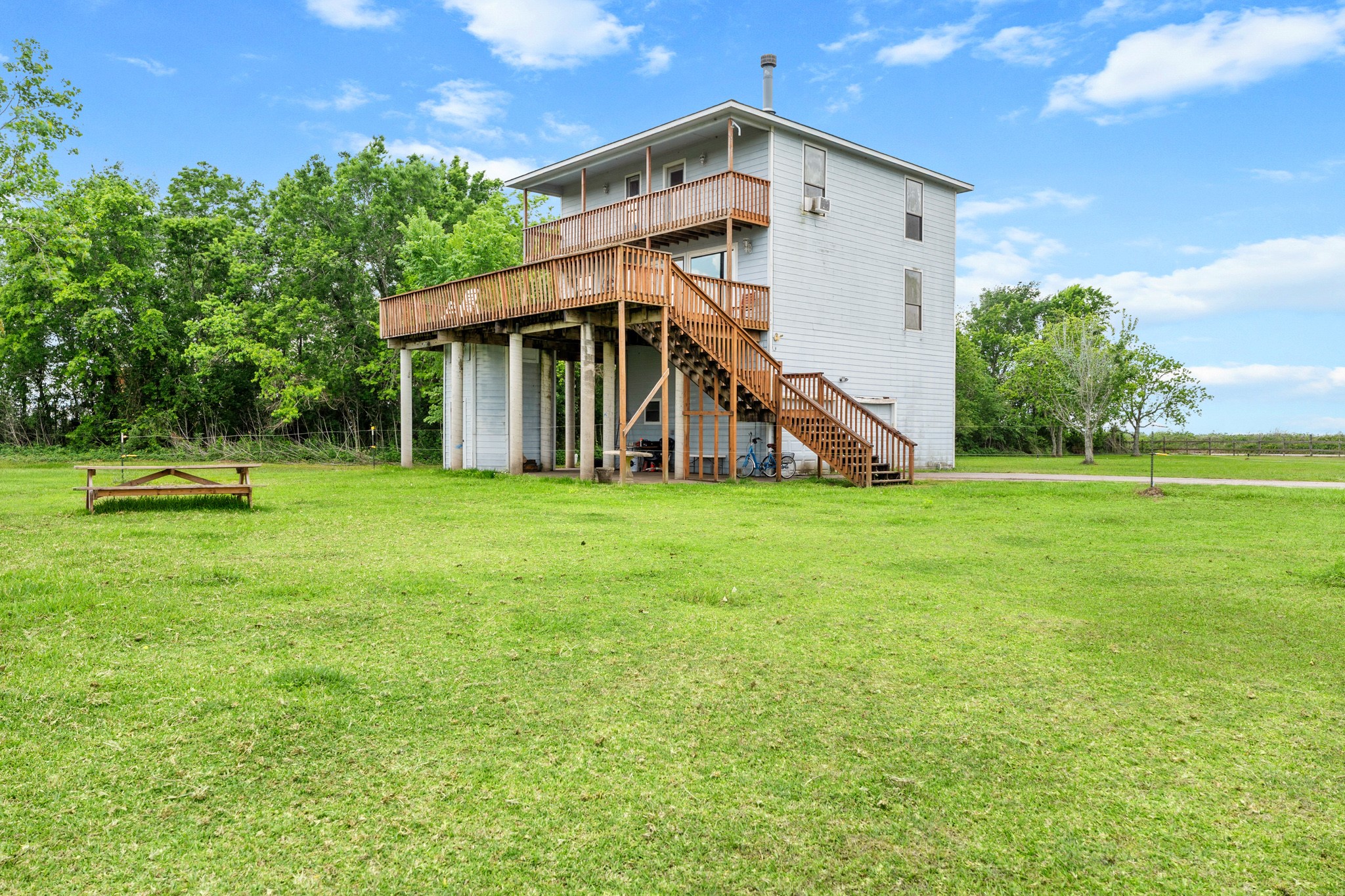 13803 Norris Road Rosharon, TX 77583 - Photo 16 of 20 a view of a house with a yard and sitting area