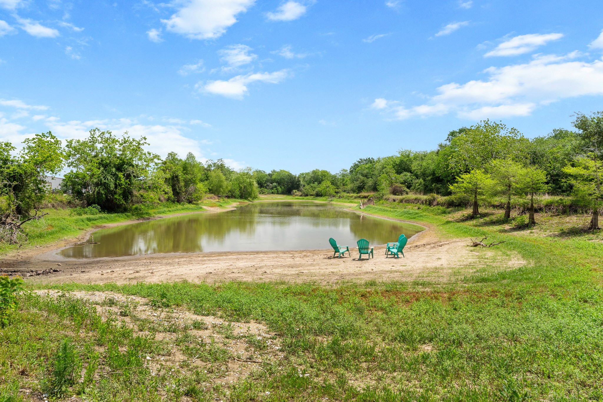 13803 Norris Road Rosharon, TX 77583 - Photo 17 of 20 a view of a lake with houses in the back