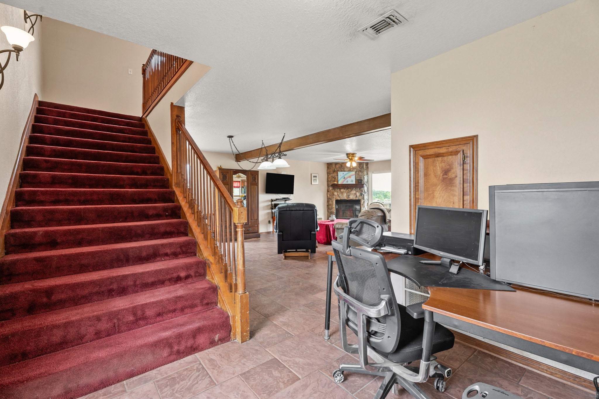 13803 Norris Road Rosharon, TX 77583 - Photo 7 of 20 a view of a livingroom with workspace and a window