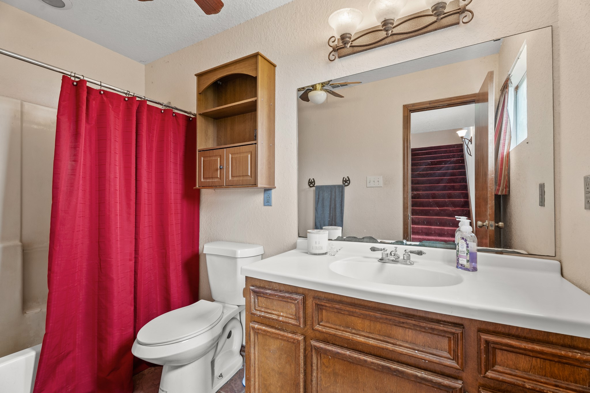 13803 Norris Road Rosharon, TX 77583 - Photo 8 of 20 a bathroom with a sink a toilet and shower