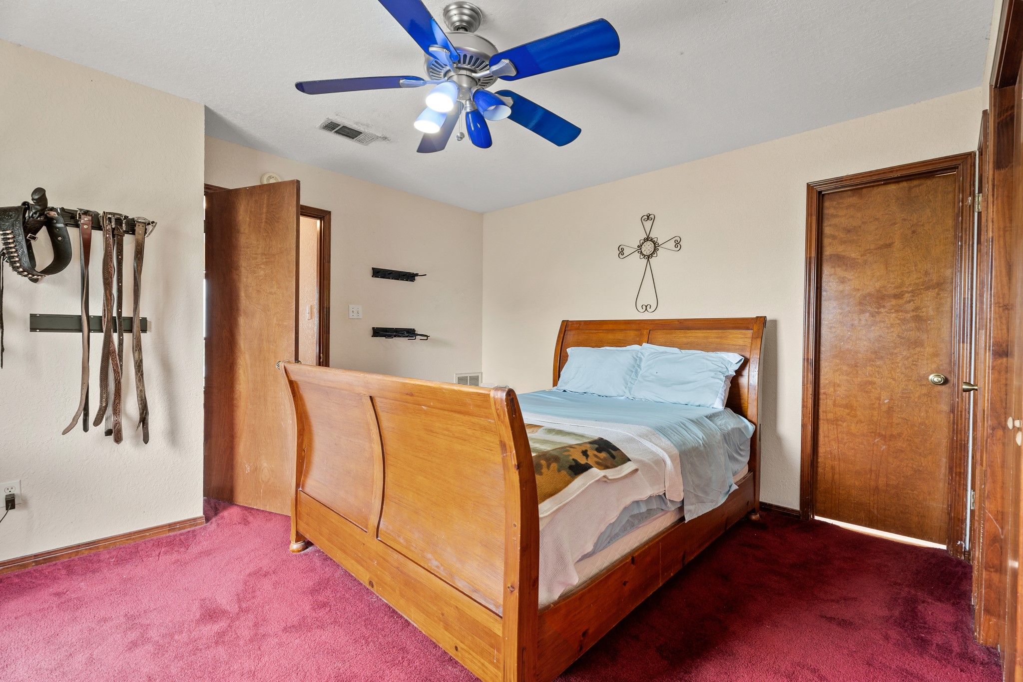 13803 Norris Road Rosharon, TX 77583 - Photo 9 of 20 a bed room with a bed and a ceiling fan