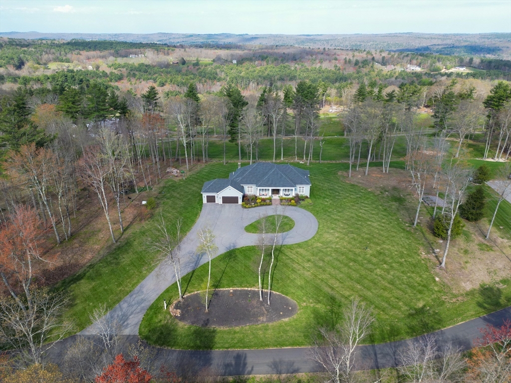 1776 Old Turnpike Road Oakham, MA 01068 - Photo 40 of 42 a view of a garden with a lake