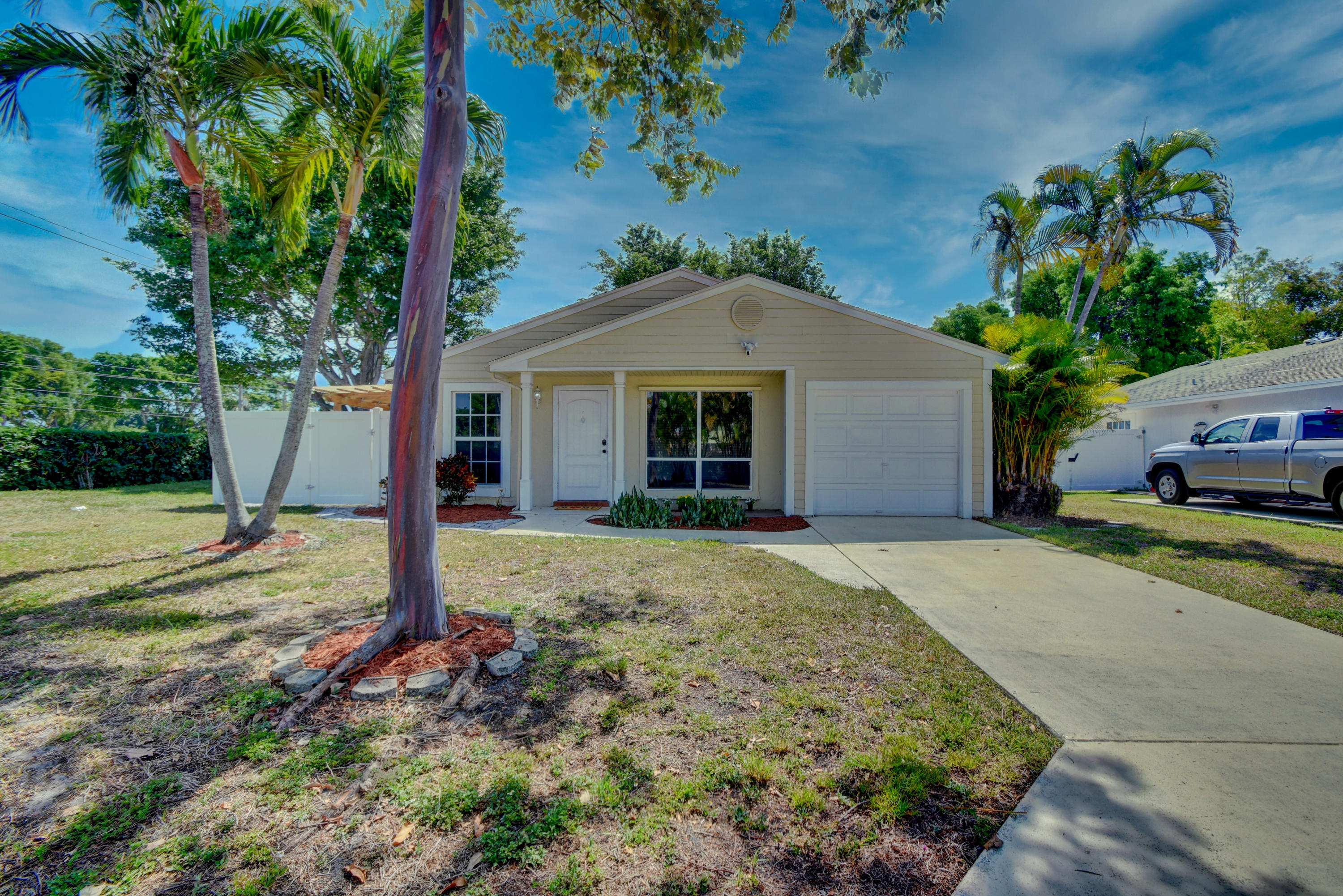 8315 Garden Gate Place Boca Raton, FL 33433 - Photo 1 of 1 a front view of a house with garden