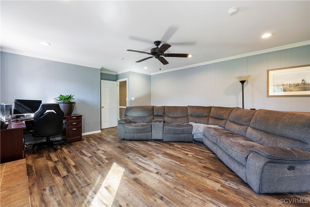 204 Pine Street Jarratt, VA 23867 - Photo 12 of 25 Living room featuring ornamental molding, a ceilin
