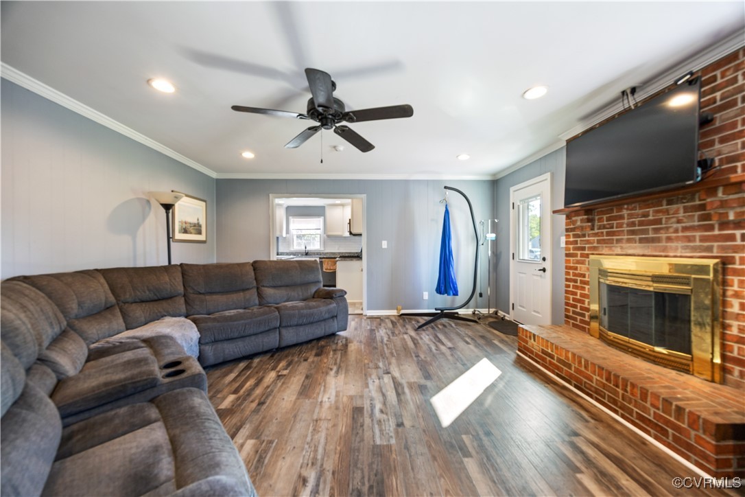 204 Pine Street Jarratt, VA 23867 - Photo 13 of 25 Living area featuring a ceiling fan, crown molding