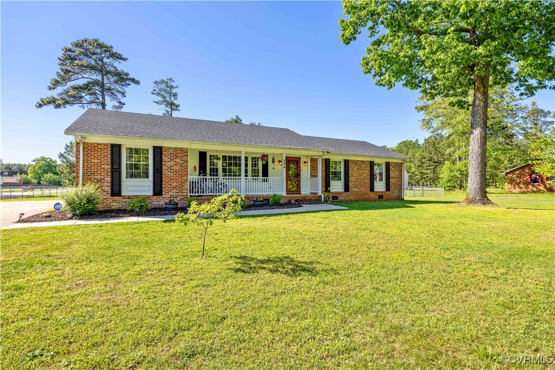 204 Pine Street Jarratt, VA 23867 - Photo 2 of 25 Single story home with brick siding, a front lawn,
