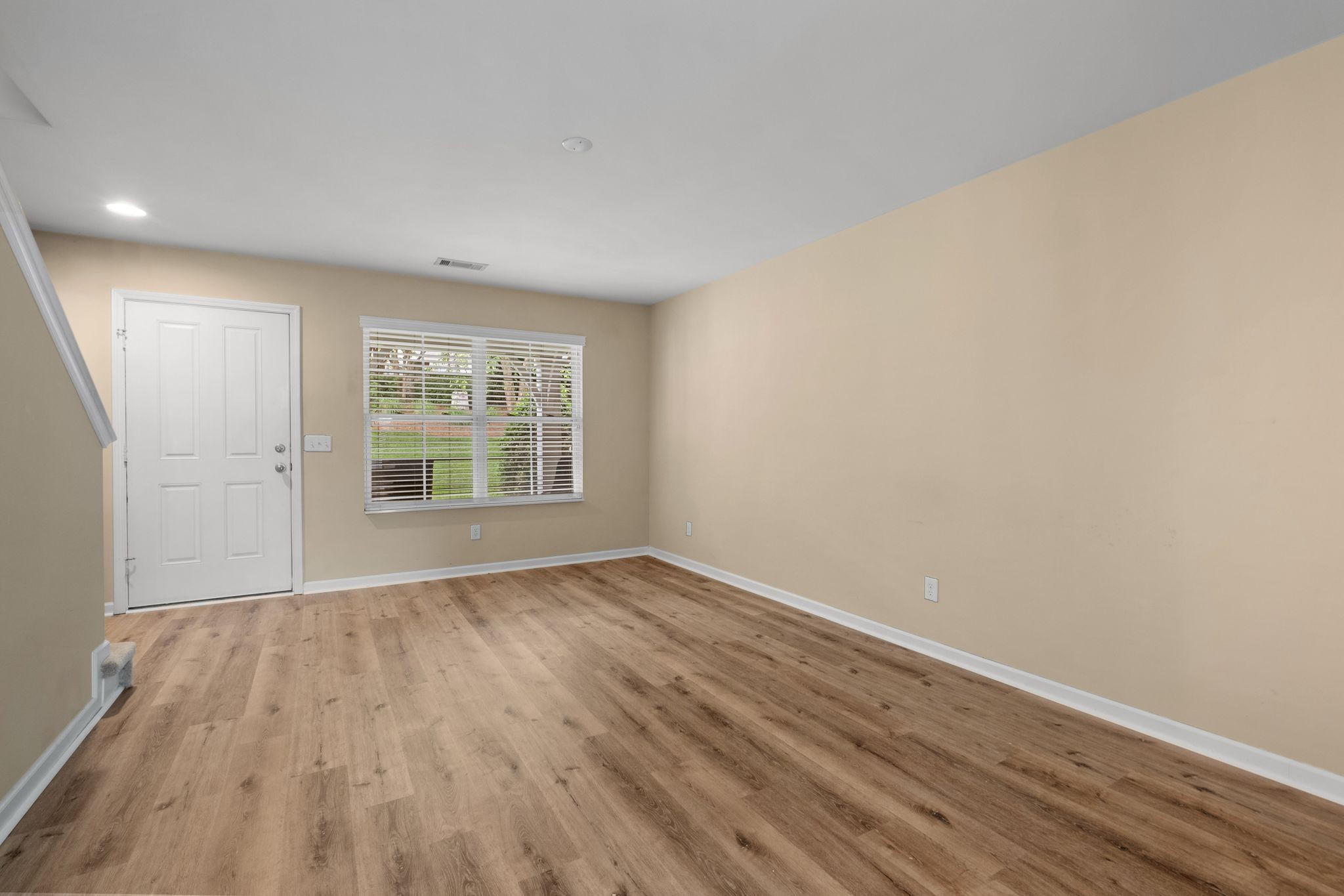 312 Mapleton Alley Hermitage, TN 37076 - Photo 14 of 49 a view of an empty room with wooden floor and a window