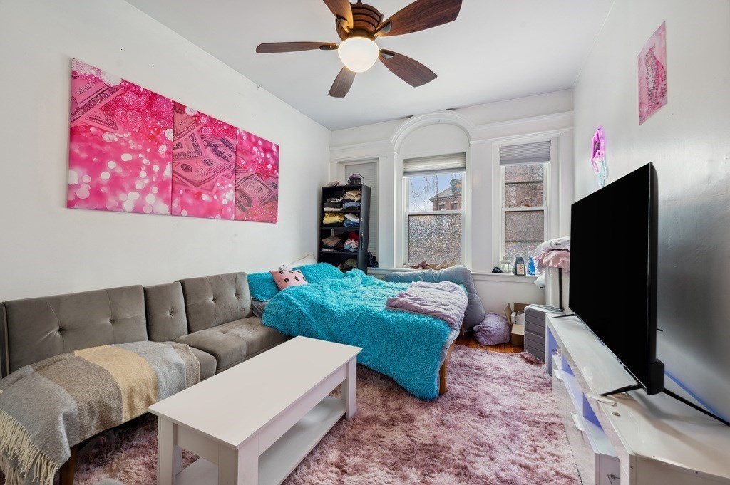 221 Shurtleff Street, Unit 1 Chelsea, MA 02150 - Photo 12 of 16 a living room with furniture and a flat screen tv