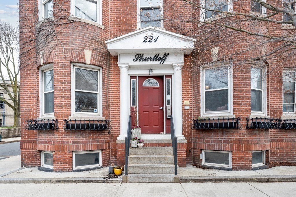 221 Shurtleff Street, Unit 1 Chelsea, MA 02150 - Photo 2 of 16 a front view of a building with a street