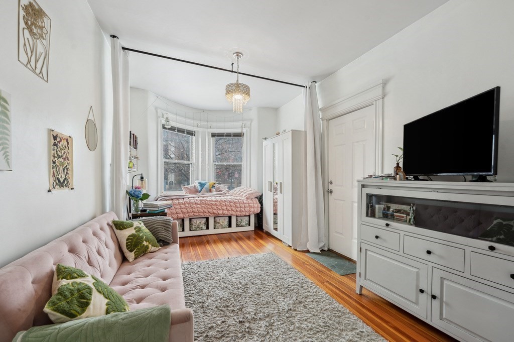 221 Shurtleff Street, Unit 1 Chelsea, MA 02150 - Photo 3 of 16 a living room with furniture and a flat screen tv