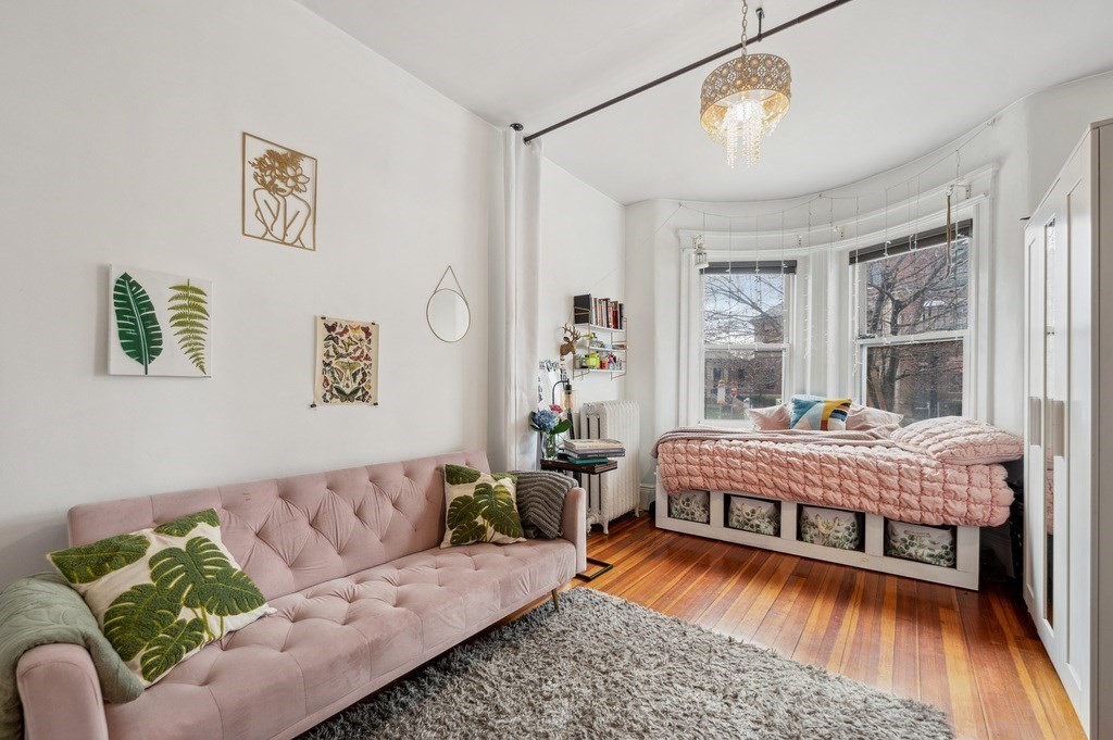 221 Shurtleff Street, Unit 1 Chelsea, MA 02150 - Photo 4 of 16 a living room with furniture and a wooden floor