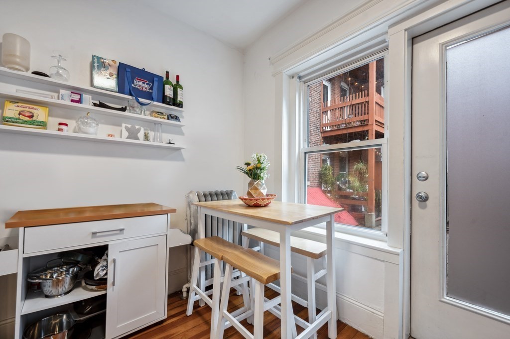 221 Shurtleff Street, Unit 1 Chelsea, MA 02150 - Photo 9 of 16 a view of a dining room with furniture and wooden floor