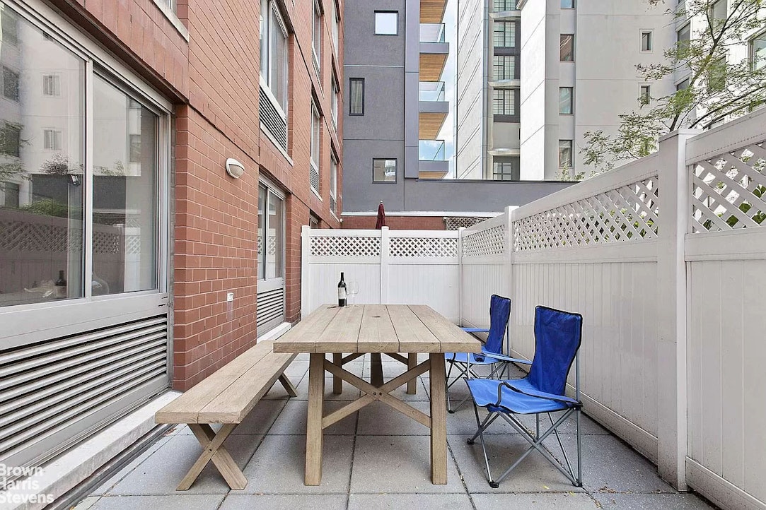 a patio with table and chairs