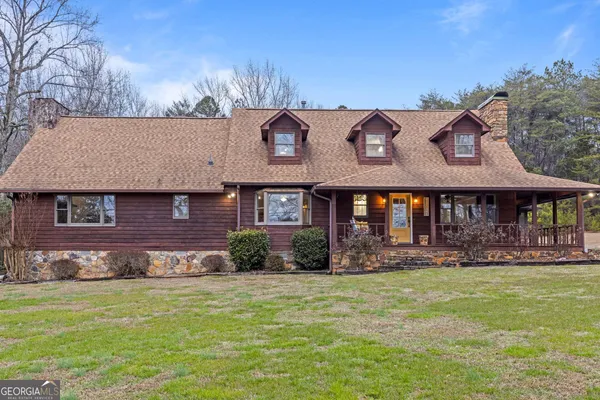 a large kitchen with stainless steel appliances lots of counter space and breakfast area