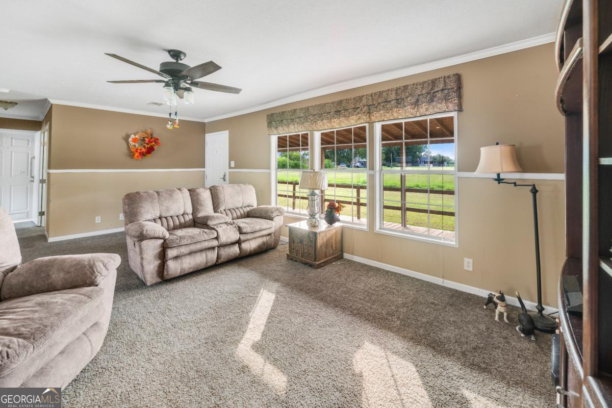 82 Harris Road Baxley, GA 31513 - Photo 20 of 23 a living room with furniture and a window