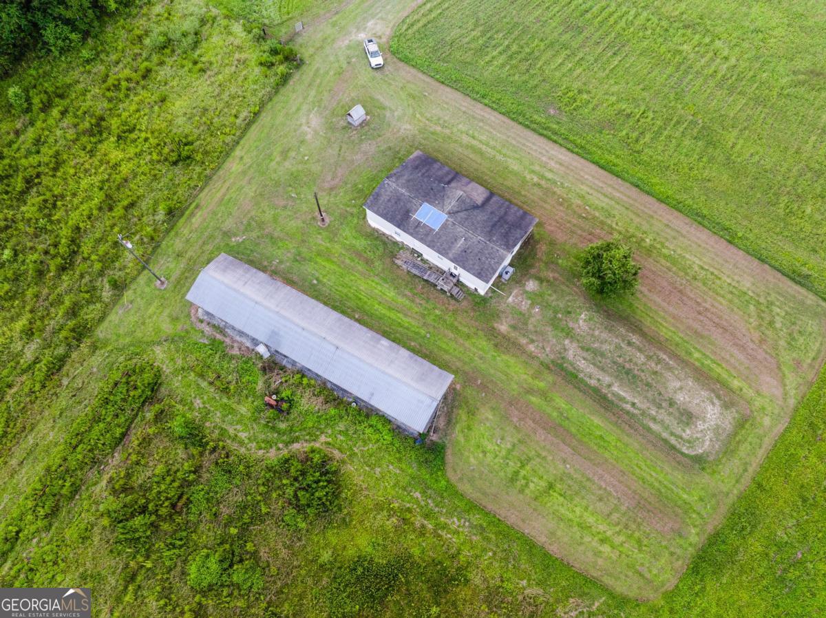 82 Harris Road Baxley, GA 31513 - Photo 23 of 23 a view of a yard with an outdoor seating