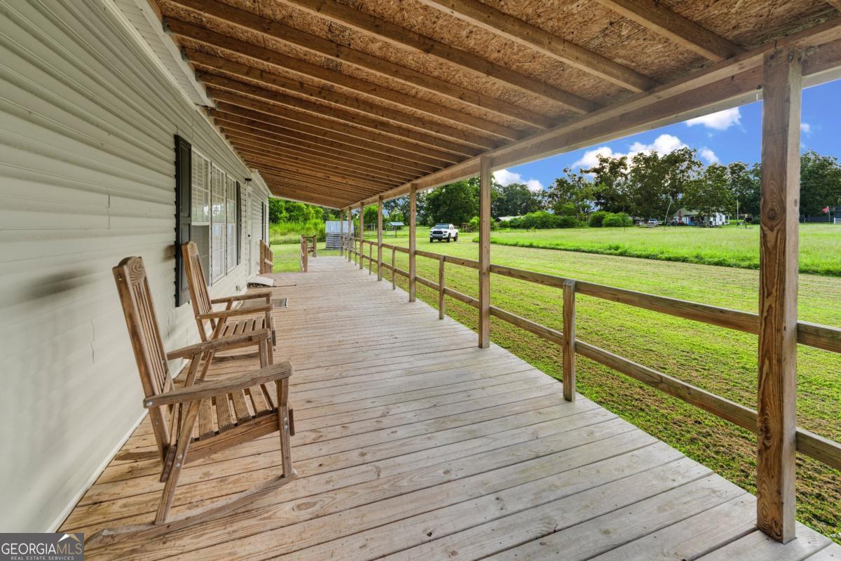 82 Harris Road Baxley, GA 31513 - Photo 5 of 23 a view of chairs and wooden floor
