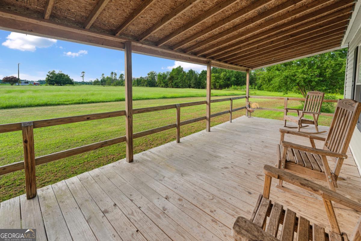 82 Harris Road Baxley, GA 31513 - Photo 6 of 23 a view of a house with a big yard