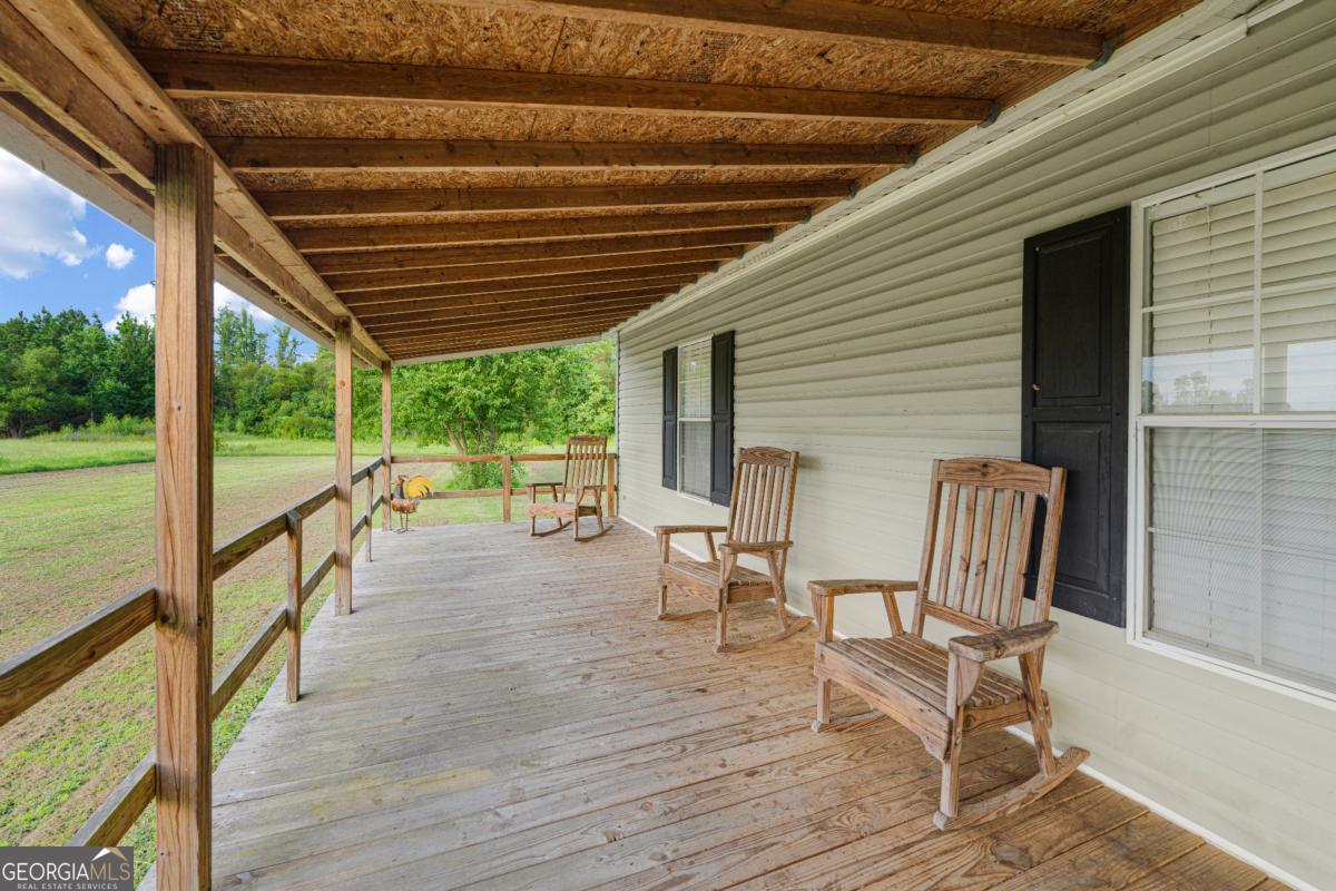 82 Harris Road Baxley, GA 31513 - Photo 7 of 23 a view of two chairs in the balcony