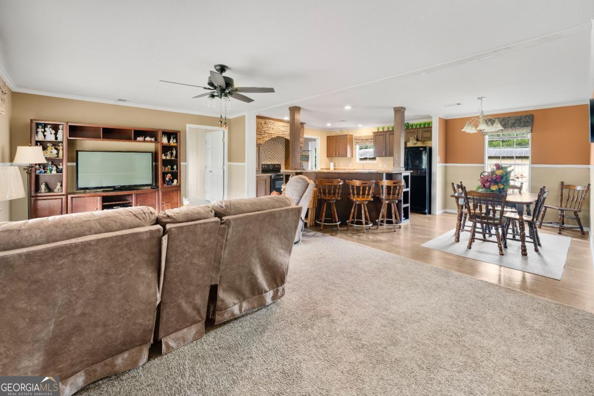 82 Harris Road Baxley, GA 31513 - Photo 8 of 23 a living room with furniture and a flat screen tv