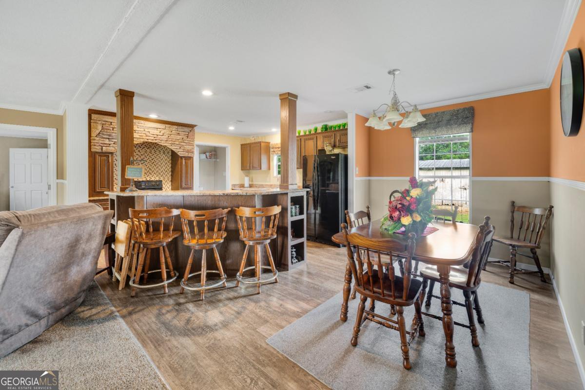 82 Harris Road Baxley, GA 31513 - Photo 10 of 23 a dining room with furniture and a floor to ceiling window