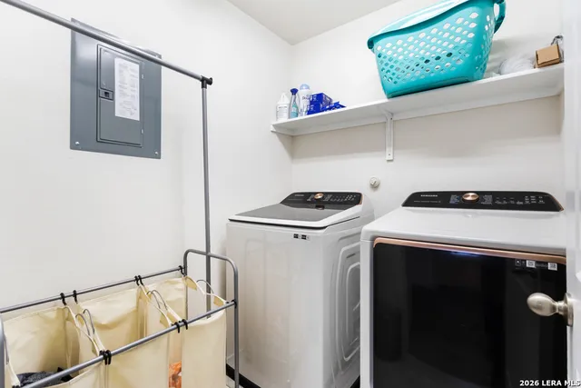 a utility room with dryer and washer