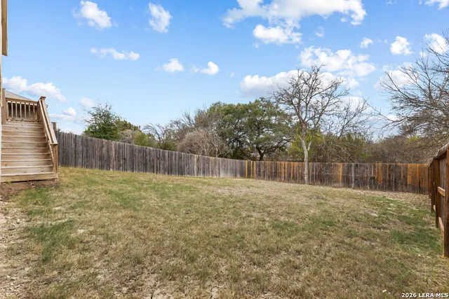 a view of backyard with tree