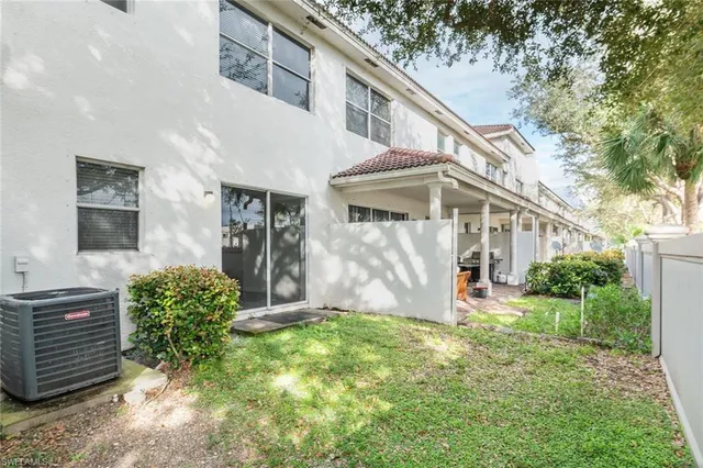 a view of a house with brick walls