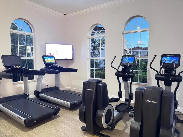 a living room with furniture a piano and a window