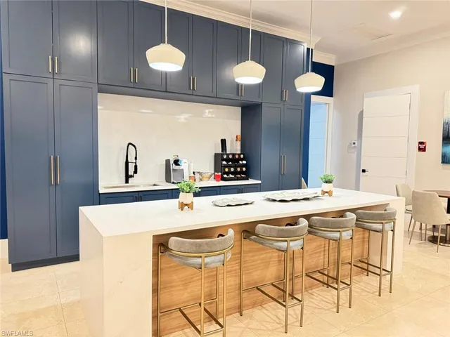 a kitchen with a table and chairs in it