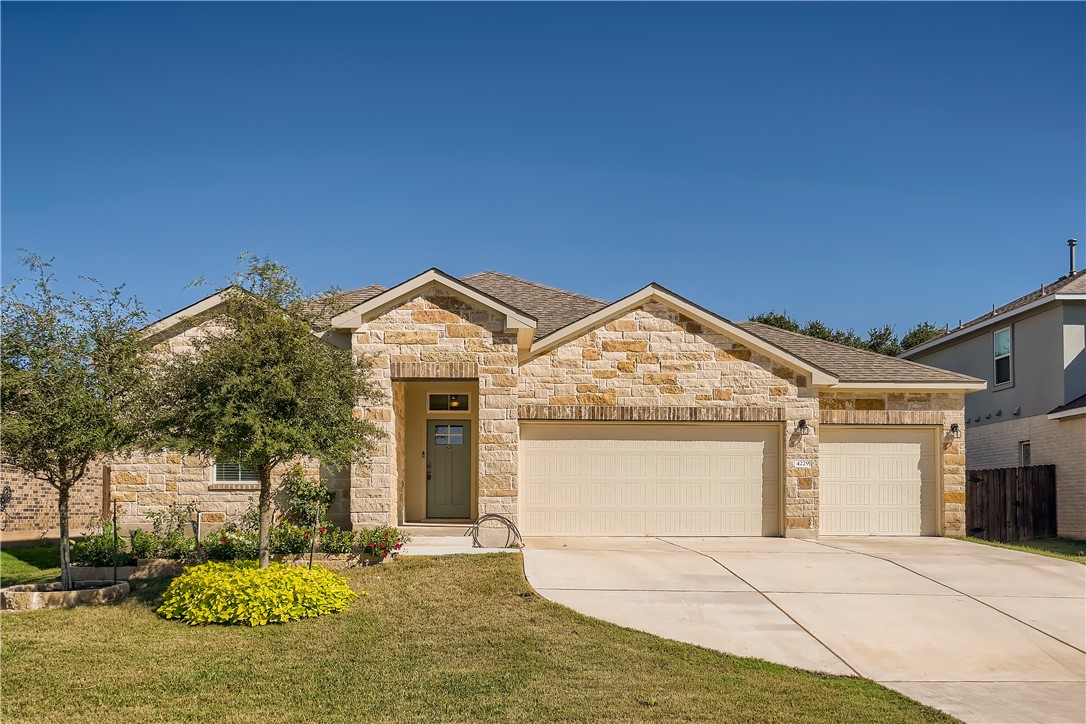4229 Porter Farm Road Georgetown, TX 78628 - Photo 1 of 1 a view of a house with a yard and garage