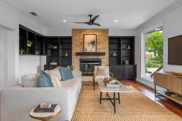 a living room with furniture and a fireplace