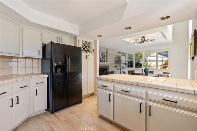 a kitchen with stainless steel appliances a stove refrigerator sink and microwave