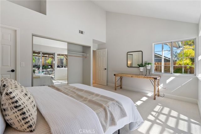 a kitchen with granite countertop a sink stove and cabinets